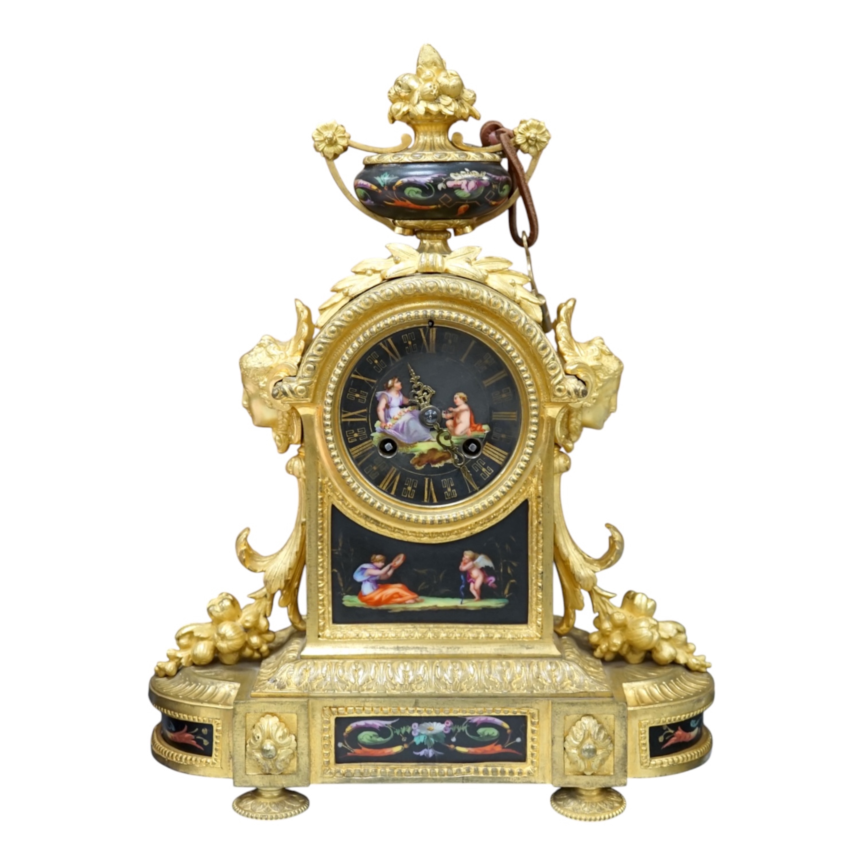 A French ormolu, black figural porcelain mounted mantel clock, 28cm wide x 36cm high. Condition - face and ormolu worn, unknown if clock working.